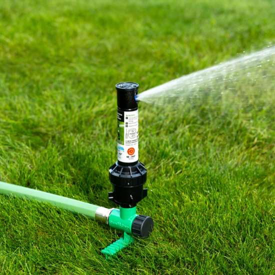 Rain Bird 32SA Rotor Sprinkler on a Spike with water on
